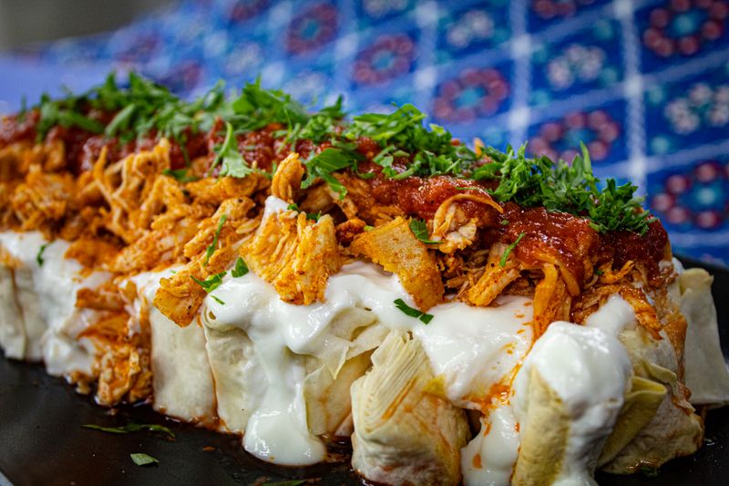 Beef enchiladas smothered in red sauce